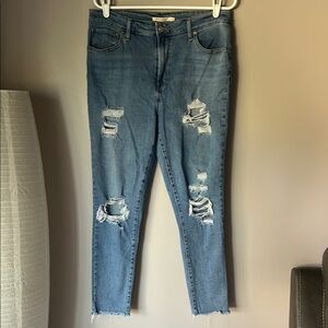 LEVIS Women’s 721 High Rise Medium Wash Distressed Skinny Jeans